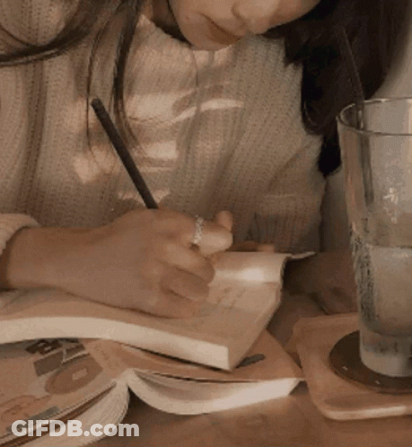 Man In Tan Suit And Tie With Hands In Pockets GIF