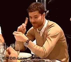 Man In Tan Sweater Eating Meat GIF