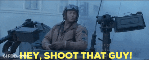 Man In Tank Saying Hey Shoot That Guy Behind Him GIF