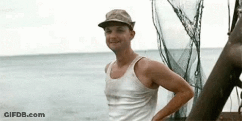 Man In Tank Top And Hat On Boat GIF