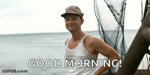Man In Tank Top And Hat Saying Good Morning On Boat GIF