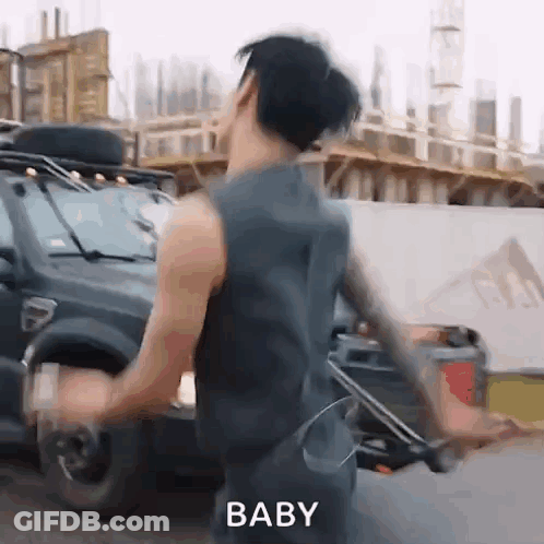 Man In Tank Top Dancing Next To Car GIF