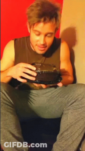 Man In Tank Top Holding Cake GIF