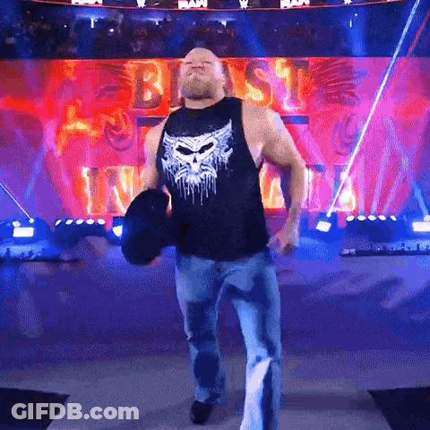 Man In Tank Top Holding Dumbbell GIF