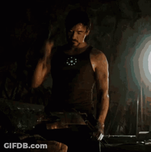 Man In Tank Top Holding Hammer GIF
