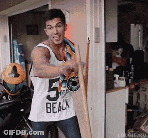 Man In Tank Top Holding Skateboard GIF