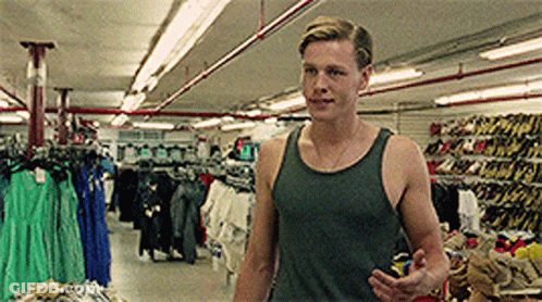 Man In Tank Top In Clothing Store GIF