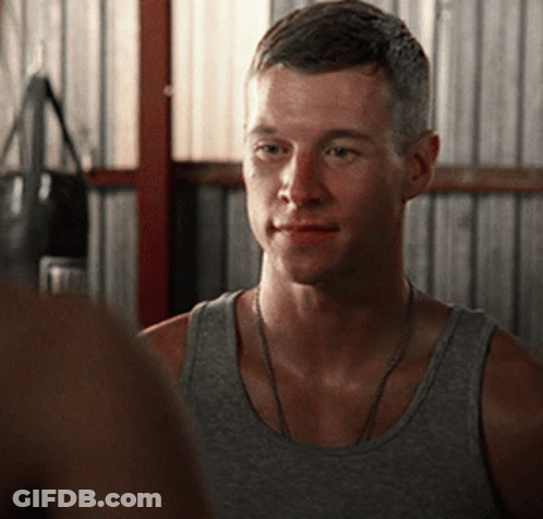 Man In Tank Top Looking GIF