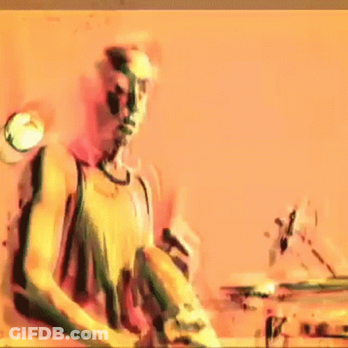 Man In Tank Top Playing Drums GIF