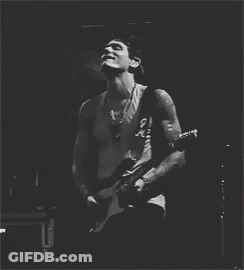 Man In Tank Top Playing Guitar GIF