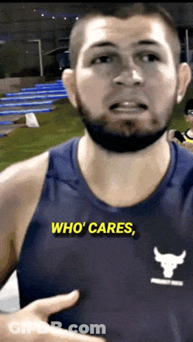 Man In Tank Top Saying Who Cares GIF
