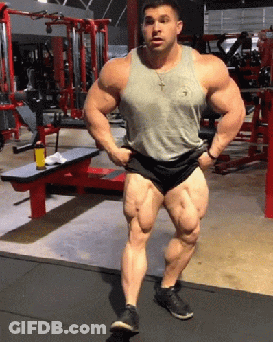 Man In Tank Top Shorts Hands On Hips GIF