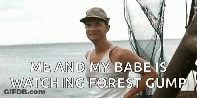 Man In Tank Top Standing On Boat GIF
