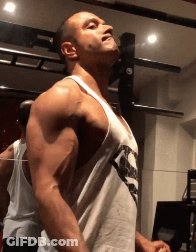 Man In Tank Top With Skulls GIF