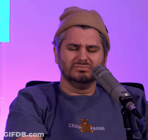 Man In Teddy Fresh T-Shirt Sitting At Microphone Eyes Closed GIF