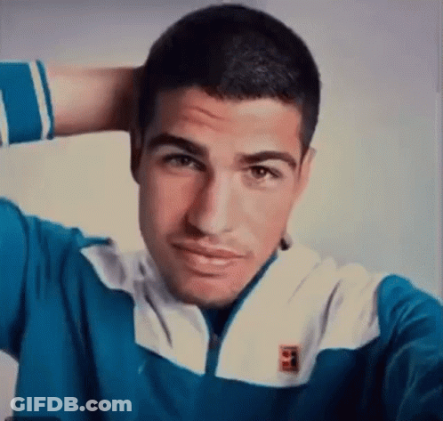 Man In Tennis Uniform Making Funny Face To Crowd GIF