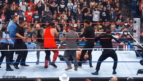 Man In Texas A&M Shirt Standing In Wrestling Ring GIF
