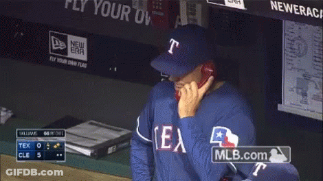 Man In Texas Jersey Talking On Phone GIF