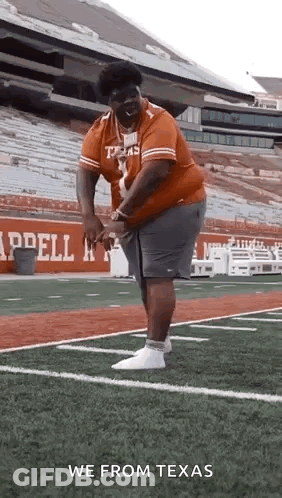 Man In Texas Shirt And Shorts On Field GIF