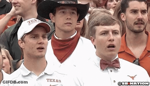 Man In Texas Shirt In Crowd GIF