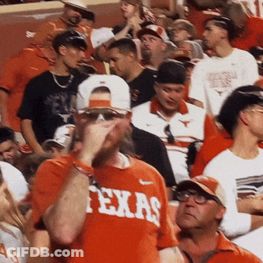 Man In Texas Shirt In Crowd GIF