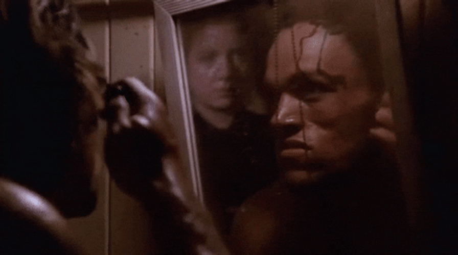 Man In The Mirror Combing Hair GIF