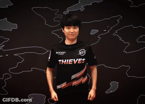 Man In Thieves Shirt Flexing Muscles GIF