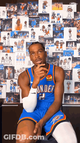 Man In Thunder Jersey Sitting In Front Of Picture Wall GIF