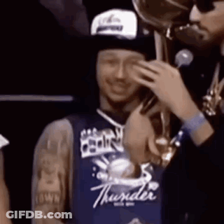 Man In Thunder Jersey Talking On Phone Holding Trophy GIF