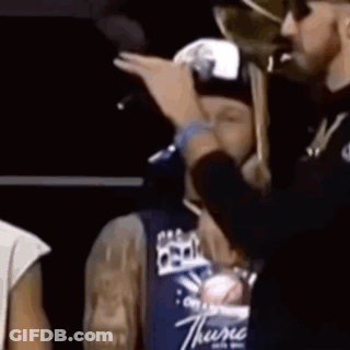 Man In Thyme Shirt Holding Microphone GIF