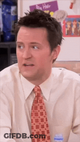 Man In Tie And White Shirt Looks Surprised GIF
