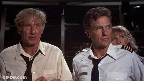 Man In Tie And Woman In Captain Uniform Standing Together GIF