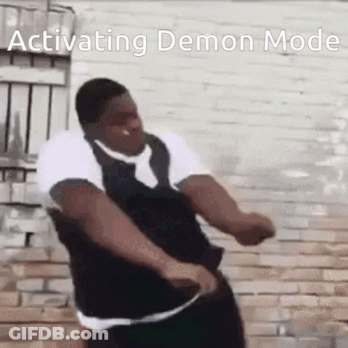 Man In Tie Dancing In Front Of Brick Wall GIF