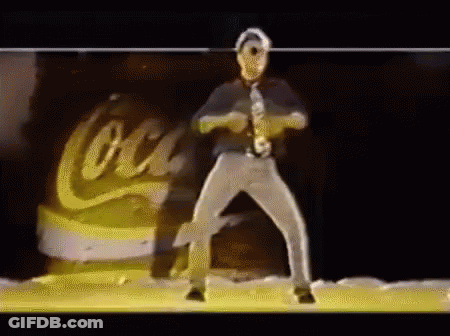 Man In Tie Dancing In Front Of Coca Cola Can GIF