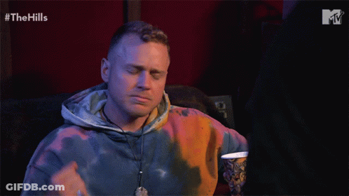 Man In Tie Dye Hoodie Watching Hills GIF