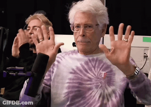 Man In Tie Dye Shirt With Letter T GIF