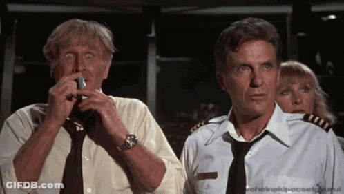 Man In Tie Holding Lighter GIF