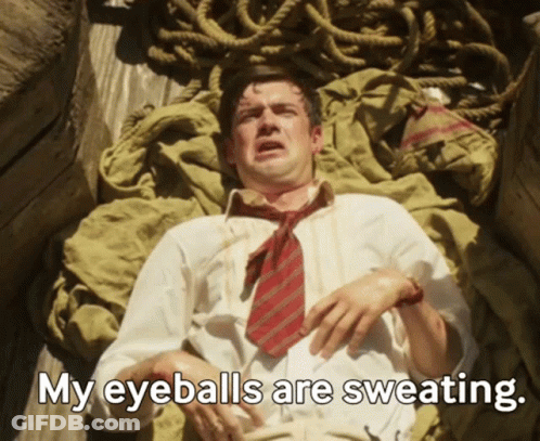 Man In Tie Laying Down Saying My Eyeballs Are Sweating GIF