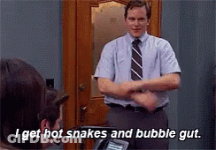 Man In Tie Says I Get Hot Snakes And Bubble Gut GIF