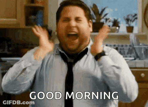 Man In Tie Screaming Good Morning In Kitchen GIF