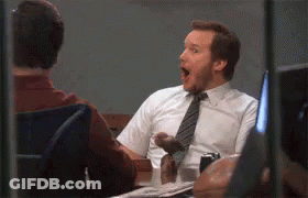 Man In Tie Sitting At Desk With Mouth Open GIF