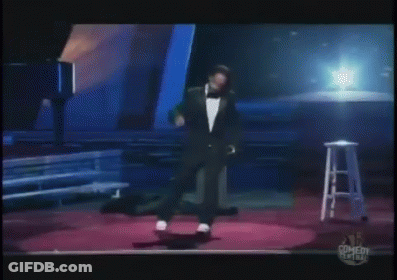 Man In Tie Standing Before Crowd GIF