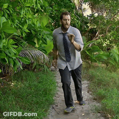 Man In Tie Walking Down Dirt Path GIF