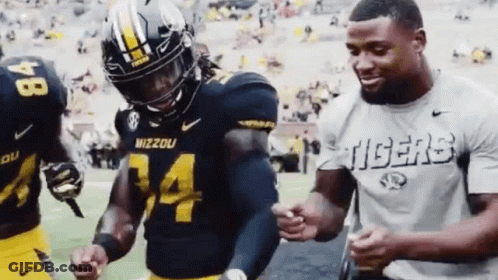 Man In Tigers Shirt Next To Mizzou Football Player GIF