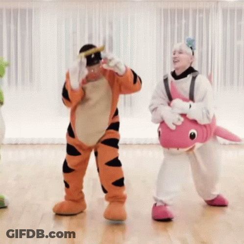 Man In Tigger Costume Photographing Woman In Pink Fish GIF