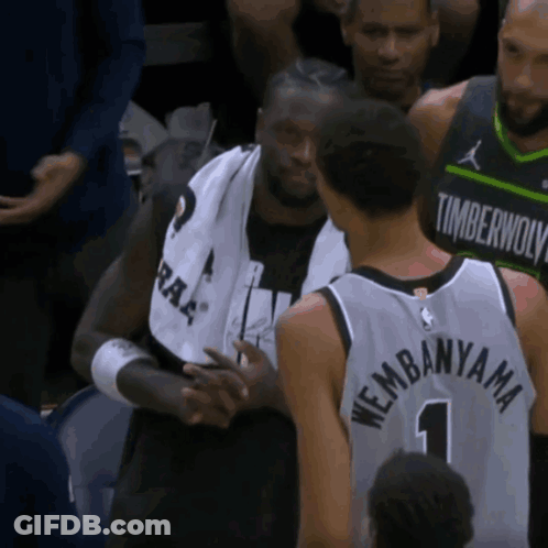 Man In Timberwolves Jersey Shaking Hands GIF