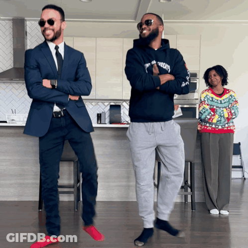Man In Tommy Hilfiger Hoodie And Woman In Christmas Sweater GIF