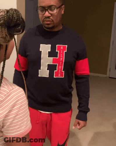 Man In Tommy Hilfiger Shirt Next To Girl GIF