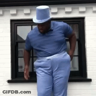 Man In Top Hat And Blue Shirt By Window GIF