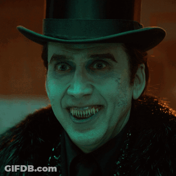 Man In Top Hat And Fur Coat With Painted Teeth GIF